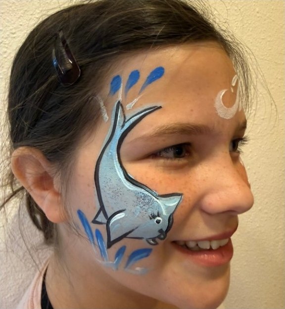 Dolphin face painting design for summer events by About Face Painting, Denver