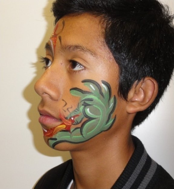 Dragon face painting design for summer events by About Face Painting, Denver