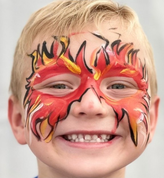 Fire Eyes face painting design for summer events by About Face Painting, Denver