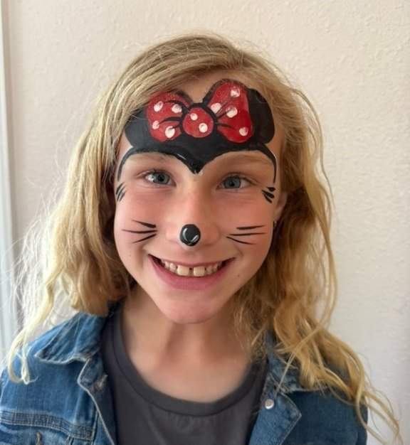 Minnie face painting design for winter and holiday events by About Face Painting, Denver