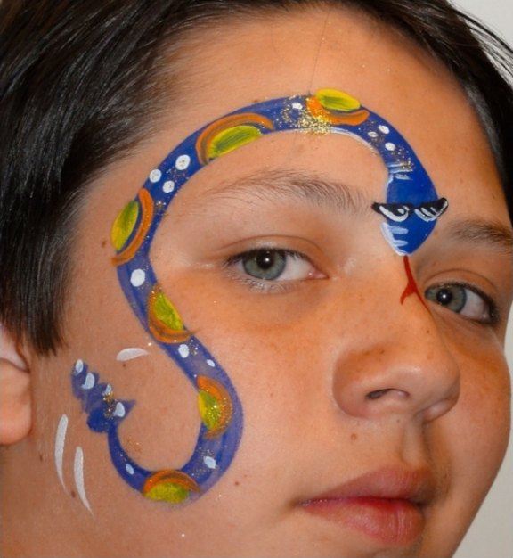 Snake face painting design for summer events by About Face Painting, Denver