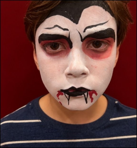 Dracula Halloween face painting design by About Face Painting, Denver