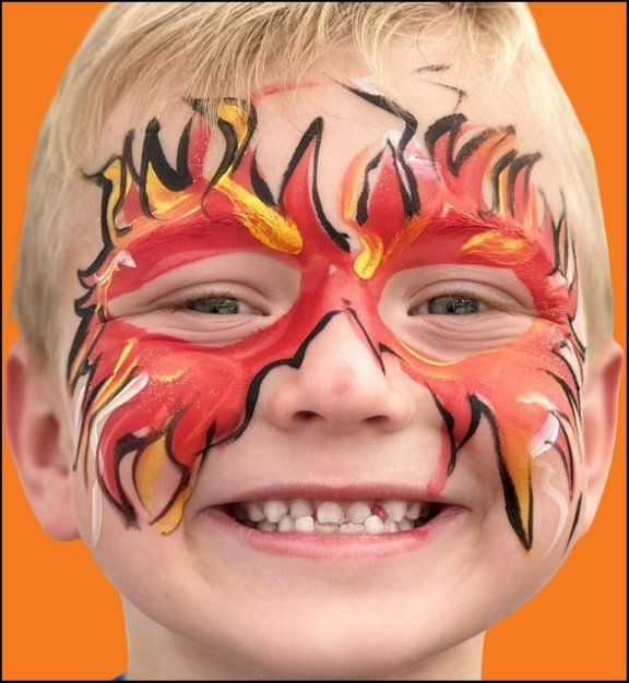 Fire Eyes Halloween face painting design by About Face Painting, Denver