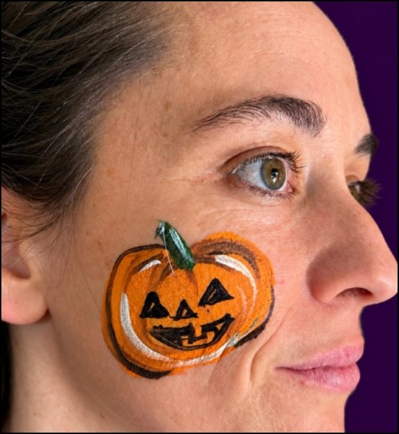 Pumpkin Halloween face painting design by About Face Painting, Denver