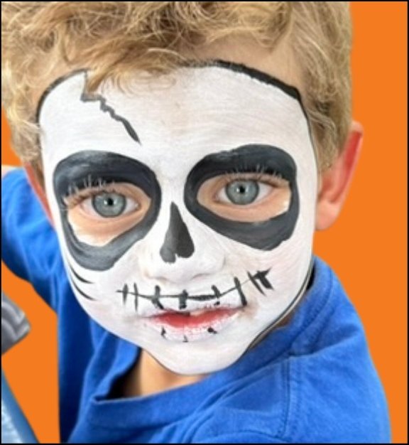 Skull Halloween face painting design by About Face Painting, Denver