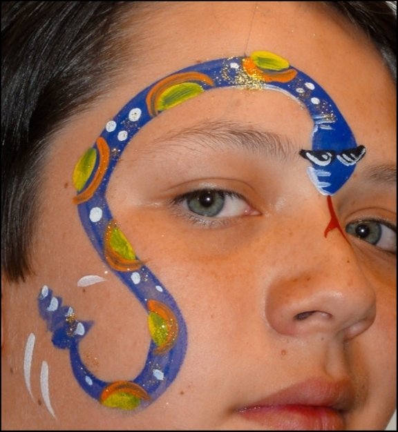 Snake Halloween face painting design by About Face Painting, Denver