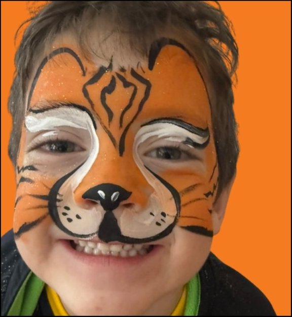 Tiger Halloween face painting design by About Face Painting, Denver
