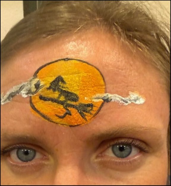Witch Moon Halloween face painting design by About Face Painting, Denver