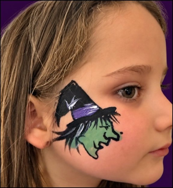 Witch Halloween face painting design by About Face Painting, Denver