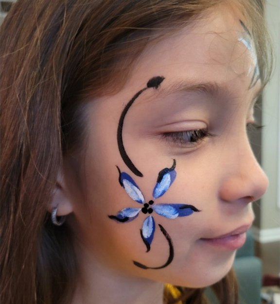 Columbine face painting design for Easter and spring events by About Face Painting, Denver