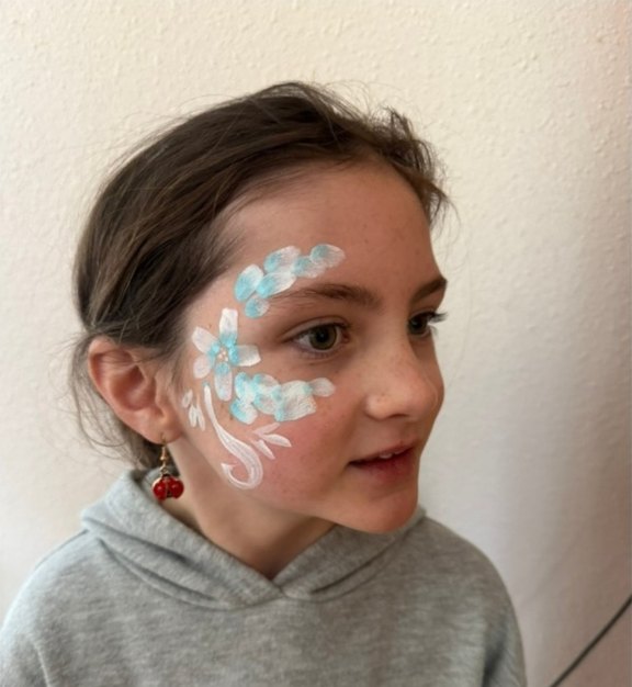 Flower Eyes face painting design for Easter and spring events by About Face Painting, Denver