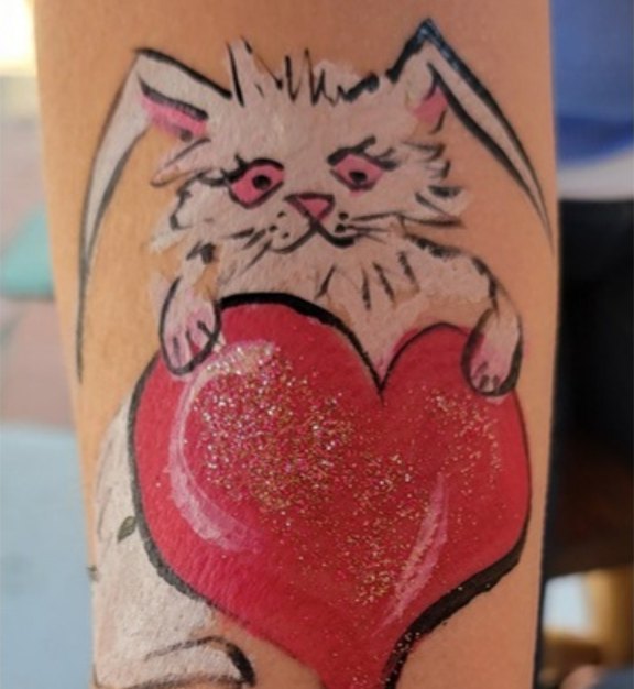 Bunny Heart face painting design for Easter and spring events by About Face Painting, Denver