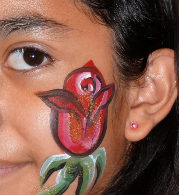 Rose face painting design for Easter and spring events by About Face Painting, Denver